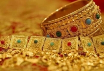 Giá vàng thế giới tăng, trong nước quay đầu giảm